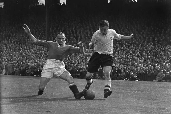Manchester Uniteds Allenby Chilton challenges Boltons Nat Lofthouse in 1951