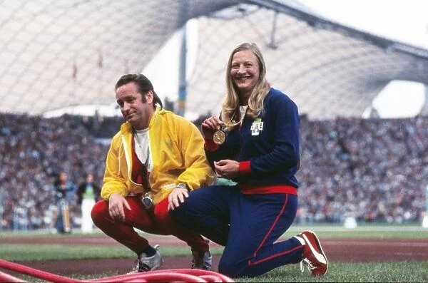 Mary Peters shows off her gold medal with coach Buster McShane at the 1972 Munich Olympics