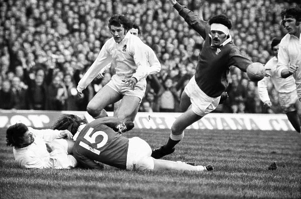 Mervyn Davies dives to intercept the ball during the 1976 Five Nations
