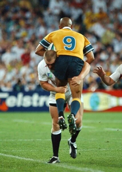 Mike Tindall dump tackles George Gregan during the 2003 World Cup Final
