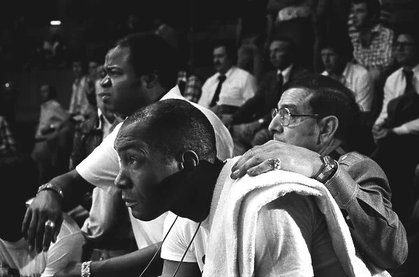 Muhamad Alis cornermen Drew Bundini Brown, Wali Muhammad and Angelo Dundee watch their man in action during a training session in 1976
