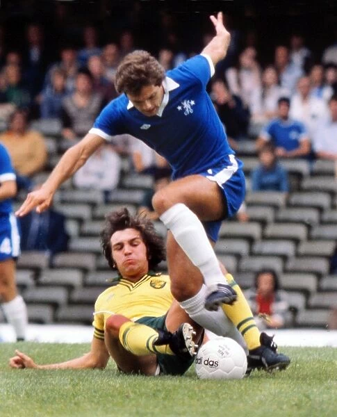 Norwichs Kevin Reeves tackles Ray Wilkins