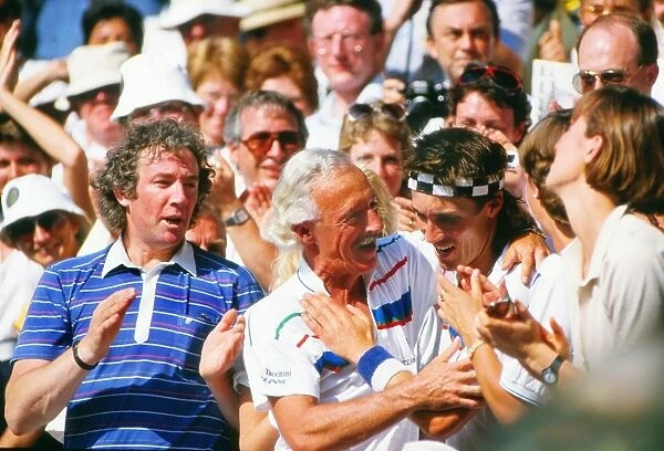 Pat Cash hugs his coach in the stand after winning the Wimbledon title