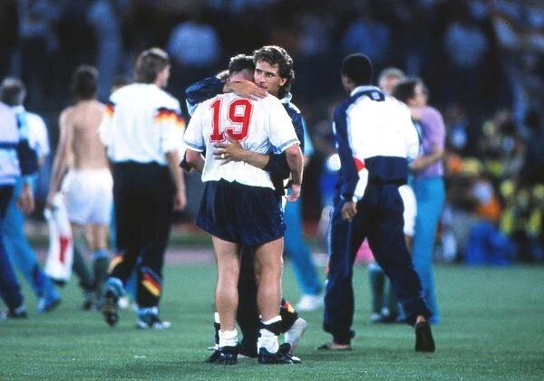 Paul Gascoigne is consoled by Tony Dorigo after England are knocked out of the 1990 World Cup