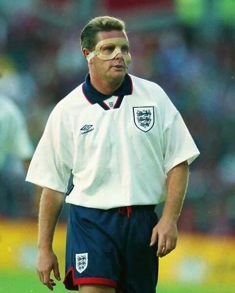 Paul Gascoigne plays with a protective face mask in 1993
