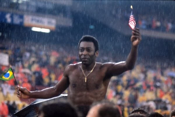 Peles Final Game. Football. Pele (Cosmos) is chaired around the pitch, holding American
