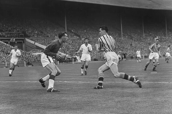 Peter McParland collides with Ray Wood during the 1957 FA Cup Final