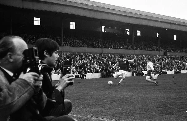 Photographers watch the action at Turf Moor in 1967