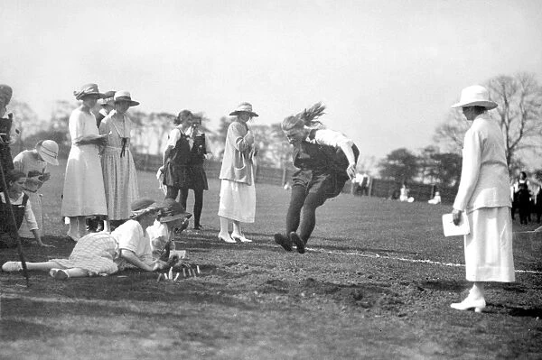 School Sports - Girls Sports day 1922 - Long jump competition.. Schoolgirls take part in a long jump