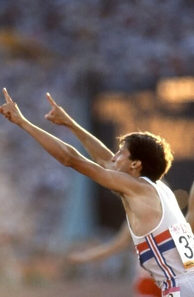 Seb Coe gestures to the press that he is no.1 after retaining his 1500m Olympic title in Los Angeles in 1984