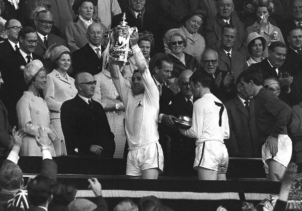 Spurs captain Dave Mackay lifts the FA Cup in 1967