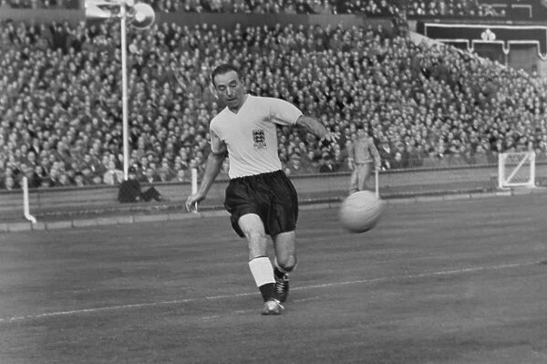 Stanley Matthews crosses the ball for England against Wales