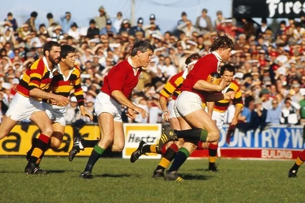 Steve Bainbridge makes a break for the British Lions with Eddie Butler in support in 1983