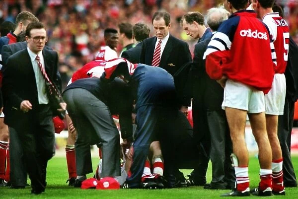 Steve Morrow lies injured after being dropped by Tony Adams during their 1993 League Cup celebrations