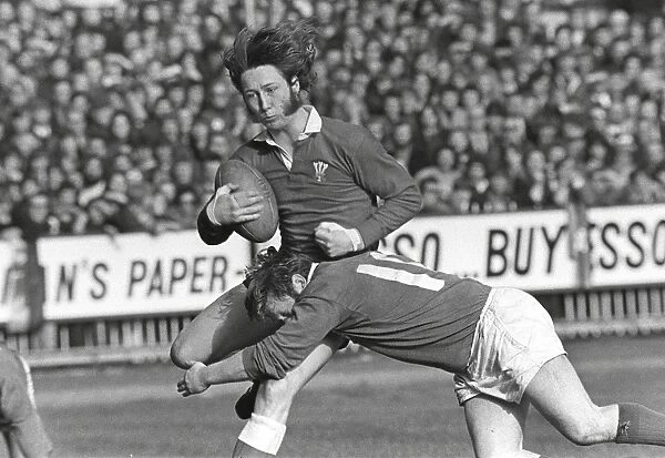 Wales JPR Williams is tackled by Irelands Barry McGann - 1973 Five Nations