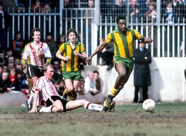 West Broms Laurie Cunningham evades a sliding tackle from Southamptons David Peach