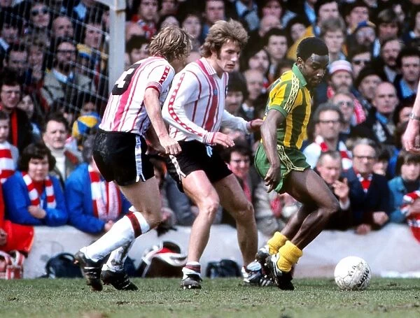West Broms Laurie Cunningham under pressure from Southamptons David Peach and Nick Holmes