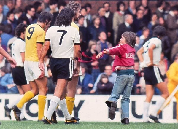 A young fan greets George Best after his debut for Fulham