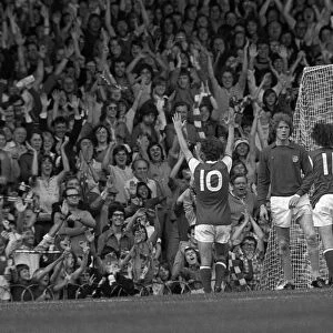 Arsenals Brian Kidd celebrates a goal in front of the North Bank