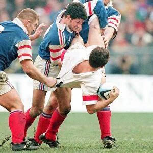 Austin Healey is tackled by Marc Lievremont in the 1998 Six Nations