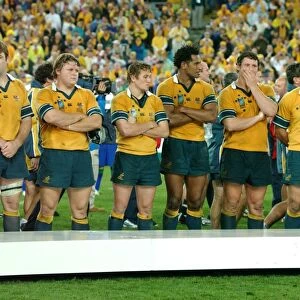 Dejected Australian players line up to receive their losers medals