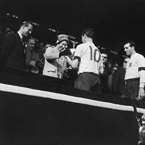 England captain Johnny Haynes receives the Home Internationa Trophy from the Queen after Englands 9-3 win over Scotland in 1961