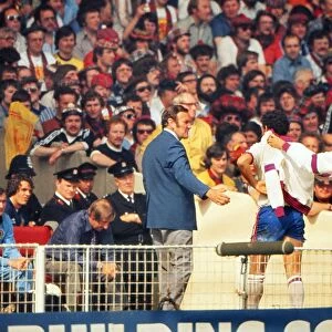 England manager Don Revie comes off the bench to meet Ray Kennedy after his substitution against Scotland- 1977 British Home Championship