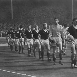 Englands Jimmy Armfield and Scotlands Eric Caldow lead out their teams at Wembley during the 1963 Home Championship