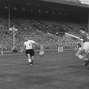 Englands Stanley Matthews crosses the ball against Wales in 1956