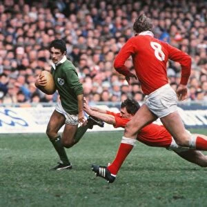 Irelands Michael Bradley makes a break against Wales - 1985 Five Nations