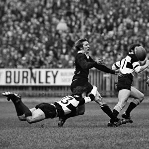 John Dawes puts in a flying tackle on Bruce Robertson during the famous 1973 Barbarians-All Blacks game