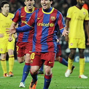 Lionel Messi and David Villa celebrate