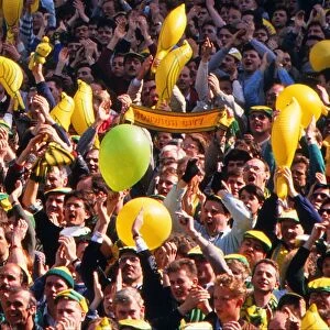 Norwich City fans cheer on their team with balloons and canary inflatables during the 1989 FA Cup