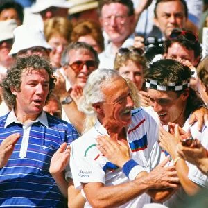 Pat Cash hugs his coach in the stand after winning the Wimbledon title