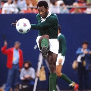 Pele plays a pass in his farewell game