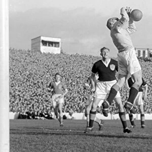 Scotland keeper Tommy Younger catches a high ball with George Young looking on in 1956