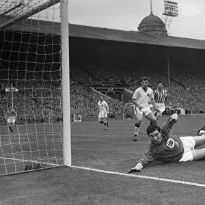 Stand-in goalkeeper Jackie Blanchflower makes a save during the 1957 FA Cup Final