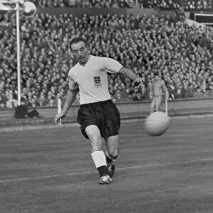 Stanley Matthews crosses the ball for England against Wales in 1956