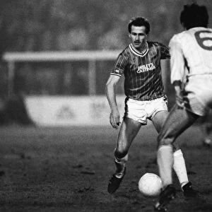 Walsalls Richard O Kelly runs at Liverpools Alan Hansen during the 1983 / 4 League Cup semi-final
