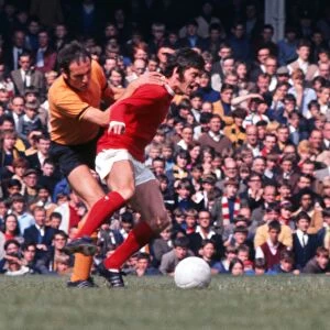 Willie Morgan and John Holsgrove compete for the ball in 1969
