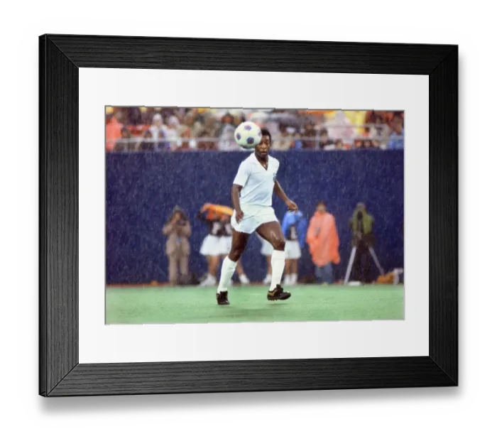 Framed Print : Pele playing for Santos in the rain during his farewell game in 1977 Framed Print : Pele playing for Santos in the rain during his farewell game in 1977