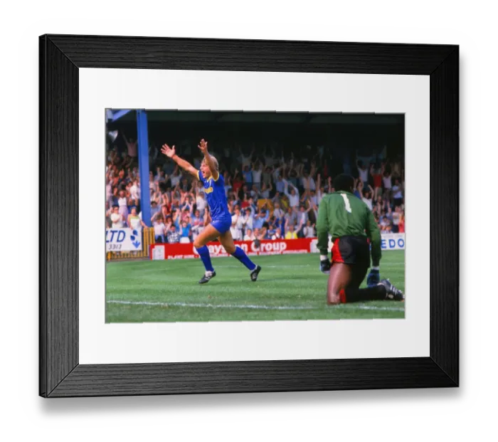 Framed Print : Glyn Hodges of Wimbledon celebrates scoring against Man City in 1984 Framed Print : Glyn Hodges of Wimbledon celebrates scoring against Man City in 1984