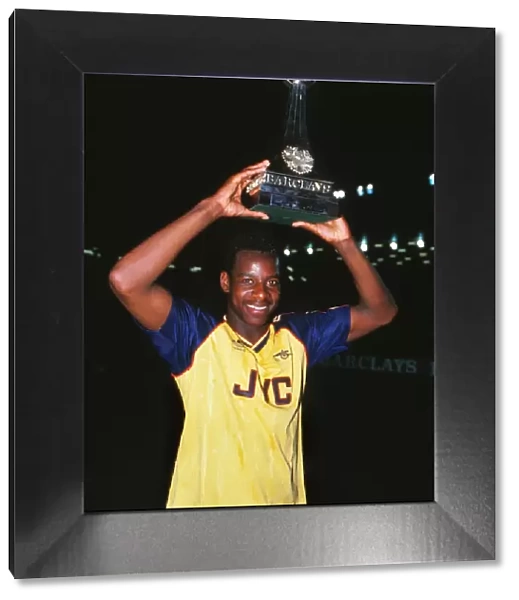 Michael Thomas celebrates with the league trophy after winning the 1988  /  9 title