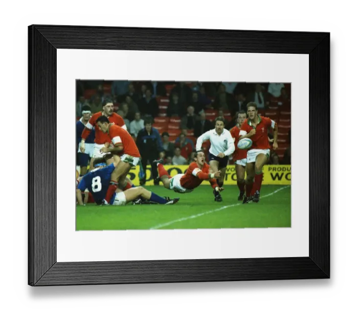 Framed Print : Rupert Moon (Wales) dive-passes the ball Framed Print : Rupert Moon (Wales) dive-passes the ball