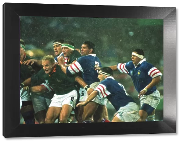 Francois Pienaar holds the line in the rain at the 1995 Rugby World Cup semi-final