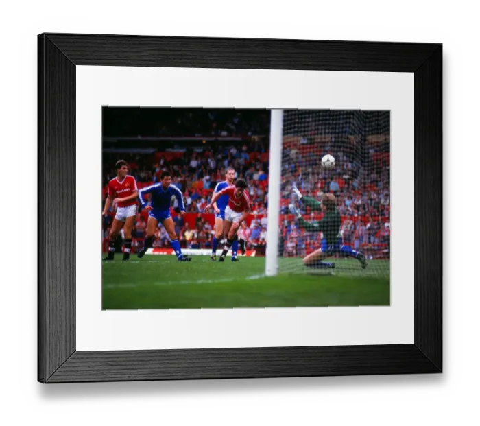 Framed Print : Frank Stapleton heads at goal in 1986 Framed Print : Frank Stapleton heads at goal in 1986