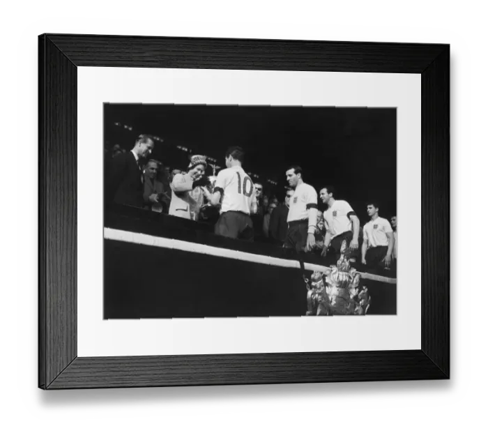 Framed Print : England captain Johnny Haynes receives the Home Internationa Trophy from the Queen after Englands 9-3 win over Scotland in 1961 Framed Print : England captain Johnny Haynes receives the Home Internationa Trophy from the Queen after Englands 9-3 win over Scotland in 1961