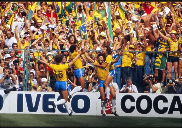 Socrates celebrates with his teammates after scoring for Brazil at the 1982 World Cup