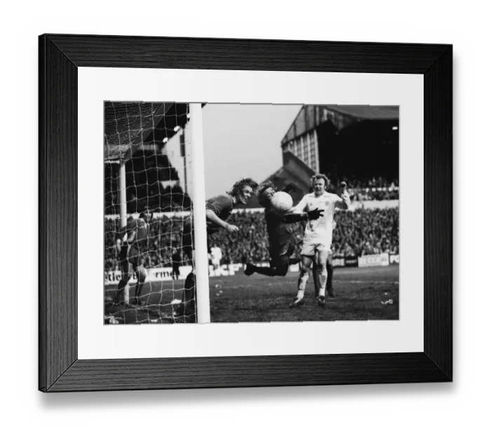 Framed Print : Wimbledon keeper Dickie Guy saves from Billy Bremner in the 1975 FA Cup Framed Print : Wimbledon keeper Dickie Guy saves from Billy Bremner in the 1975 FA Cup