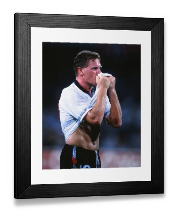 Framed Print : Paul Gascoigne kisses his shirt in celebration after victory over Cameroon at Italia 90